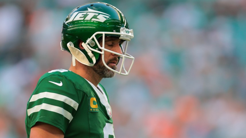 Dec 8, 2024; Miami Gardens, Florida, USA; New York Jets quarterback Aaron Rodgers (8) reacts on the field against the Miami Dolphins during the fourth quarter at Hard Rock Stadium. Mandatory Credit: Sam Navarro-Imagn Images