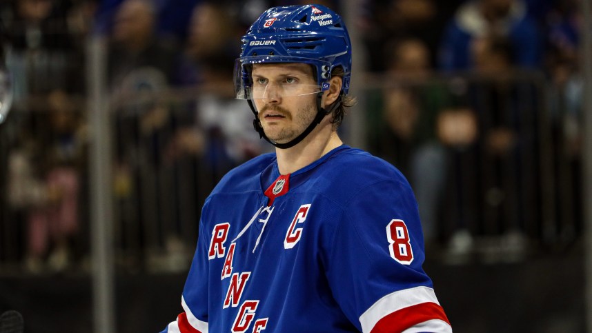 Nov 25, 2024; New York, New York, USA; New York Rangers defenseman Jacob Trouba (8) skates against the St. Louis Blues during the first period at Madison Square Garden. Mandatory Credit: Danny Wild-Imagn Images