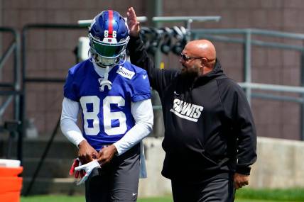 New York Giants head coach Brian Daboll, right, greets wide receiver Darius Slayton (86) on the first day of mandatory minicamp at the Giants training center in East Rutherford on Tuesday, June 13, 2023.