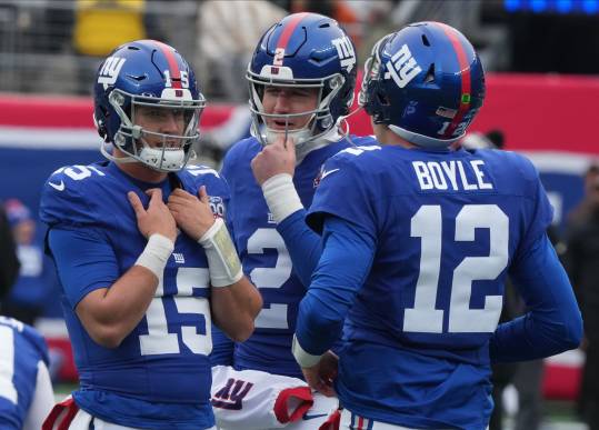 East Rutherford, NJ -- December 15, 2024 -- GiantÕs quarterbacks Tommy DeVito, Drew Lock and Tim Boyle during pre game warm ups as the Baltimore Ravens came to MetLife Stadium to play the New York Giants.