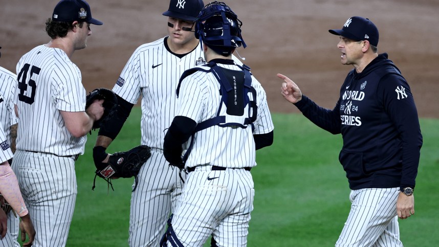 Oct 30, 2024; New York, New York, USA; New York Yankees manager Aaron Boone (17) makes a pitching change taking out pitcher Gerrit Cole (45) during the seventh inning against the Los Angeles Dodgers in game five of the 2024 MLB World Series at Yankee Stadium. Mandatory Credit: Wendell Cruz-Imagn Images