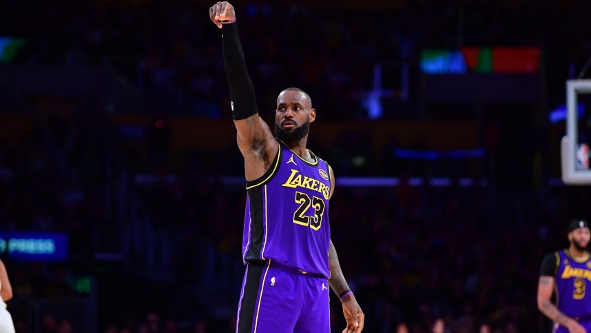 Jan 3, 2025; Los Angeles, California, USA;  Los Angeles Lakers forward LeBron James (23) reacts after scoring three point basket against the Atlanta Hawks during the second half at Crypto.com Arena. Mandatory Credit: Gary A. Vasquez-Imagn Images