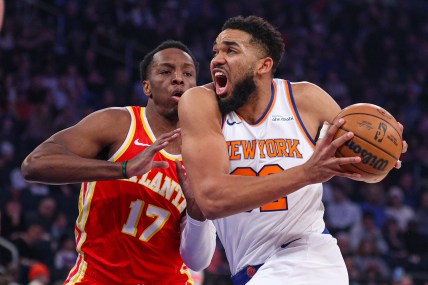 Jan 20, 2025; New York, New York, USA; New York Knicks center Karl-Anthony Towns (32) goes to the basket against Atlanta Hawks forward Onyeka Okongwu (17) during the first half at Madison Square Garden. Mandatory Credit: Vincent Carchietta-Imagn Images