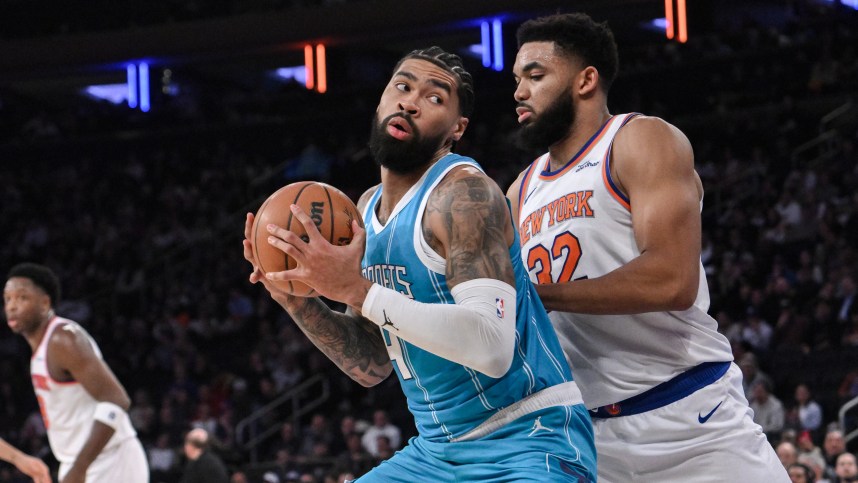 Dec 5, 2024; New York, New York, USA; Charlotte Hornets center Nick Richards (4) posts up against New York Knicks center Karl-Anthony Towns (32) during the first half at Madison Square Garden. Mandatory Credit: John Jones-Imagn Images