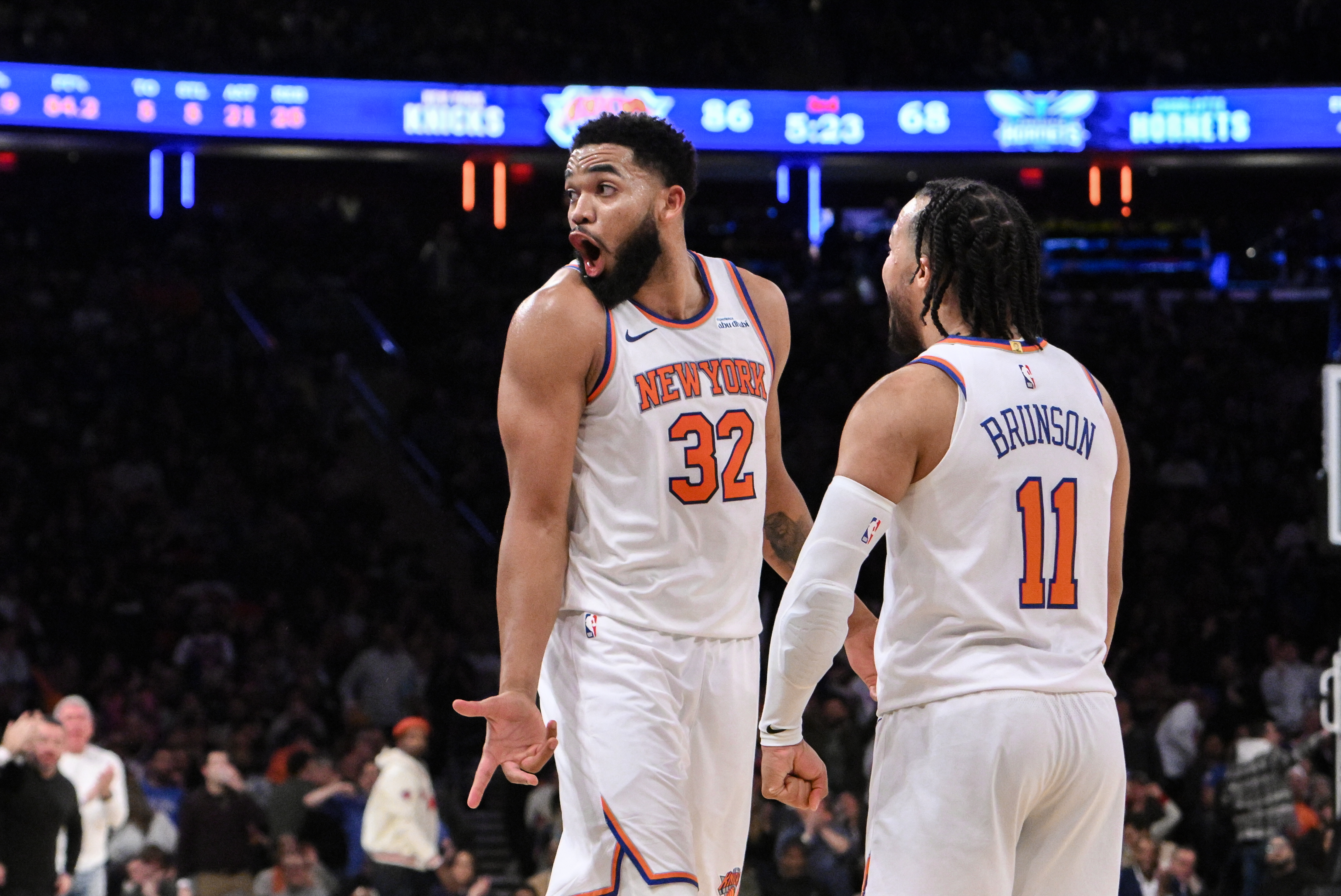 Dec 5, 2024; New York, New York, USA; New York Knicks center Karl-Anthony Towns (32) and New York Knicks guard Jalen Brunson (11) react during the second half against the Charlotte Hornets at Madison Square Garden. Mandatory Credit: John Jones-Imagn Images