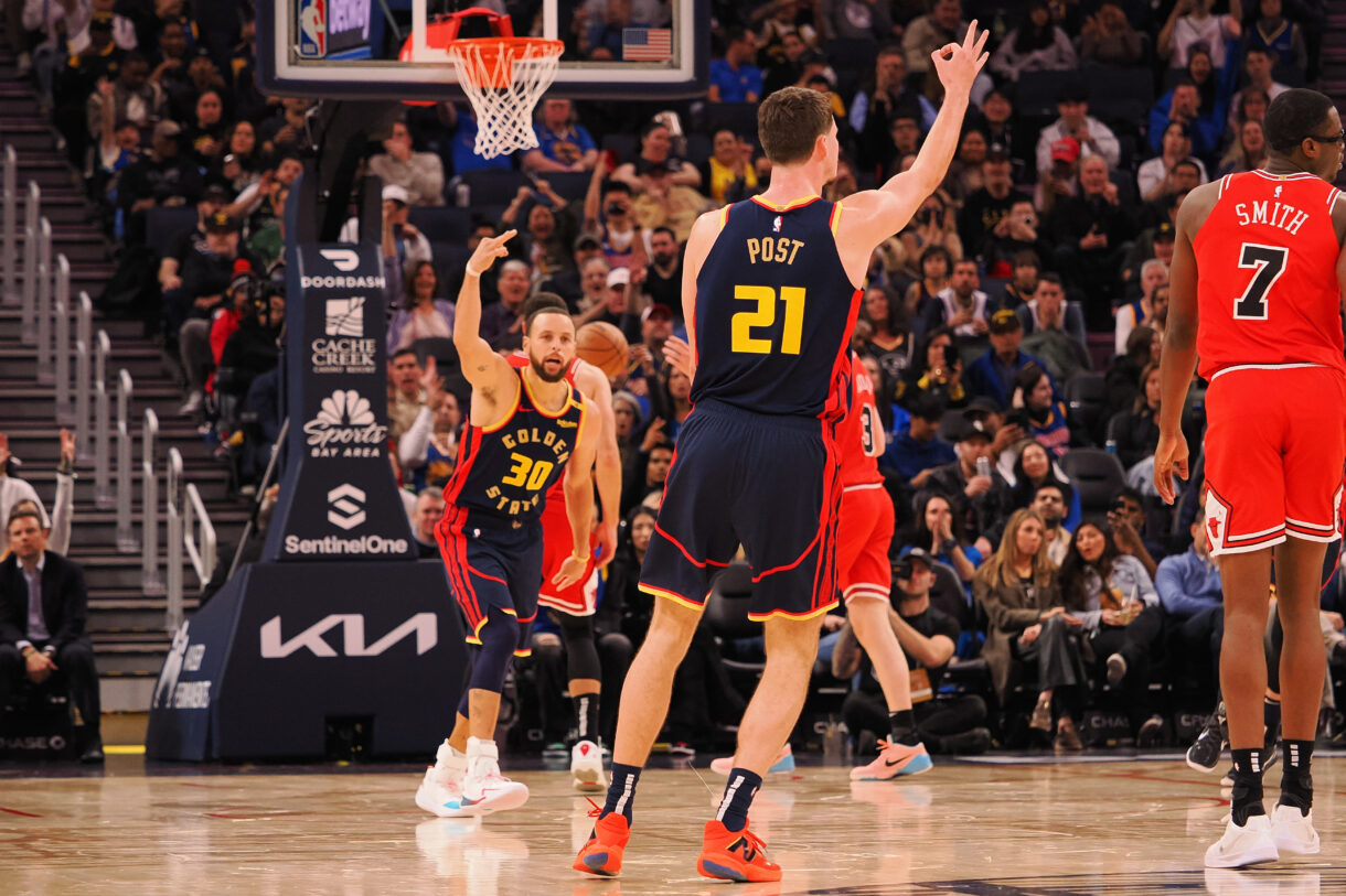 Jan 23, 2025; San Francisco, California, USA; Golden State Warriors center Quinten Post (21) celebrates with guard Stephen Curry (30) after scoring a three point basket against the Chicago Bulls during the fourth quarter at Chase Center. Mandatory Credit: Kelley L Cox-Imagn Images
