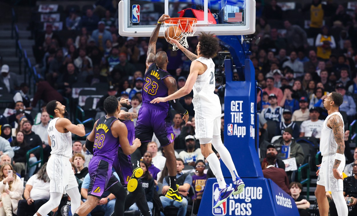 Jan 7, 2025; Dallas, Texas, USA;  Los Angeles Lakers forward LeBron James (23) dunks past Dallas Mavericks center Dereck Lively II (2) during the first quarter at American Airlines Center. Mandatory Credit: Kevin Jairaj-Imagn Images