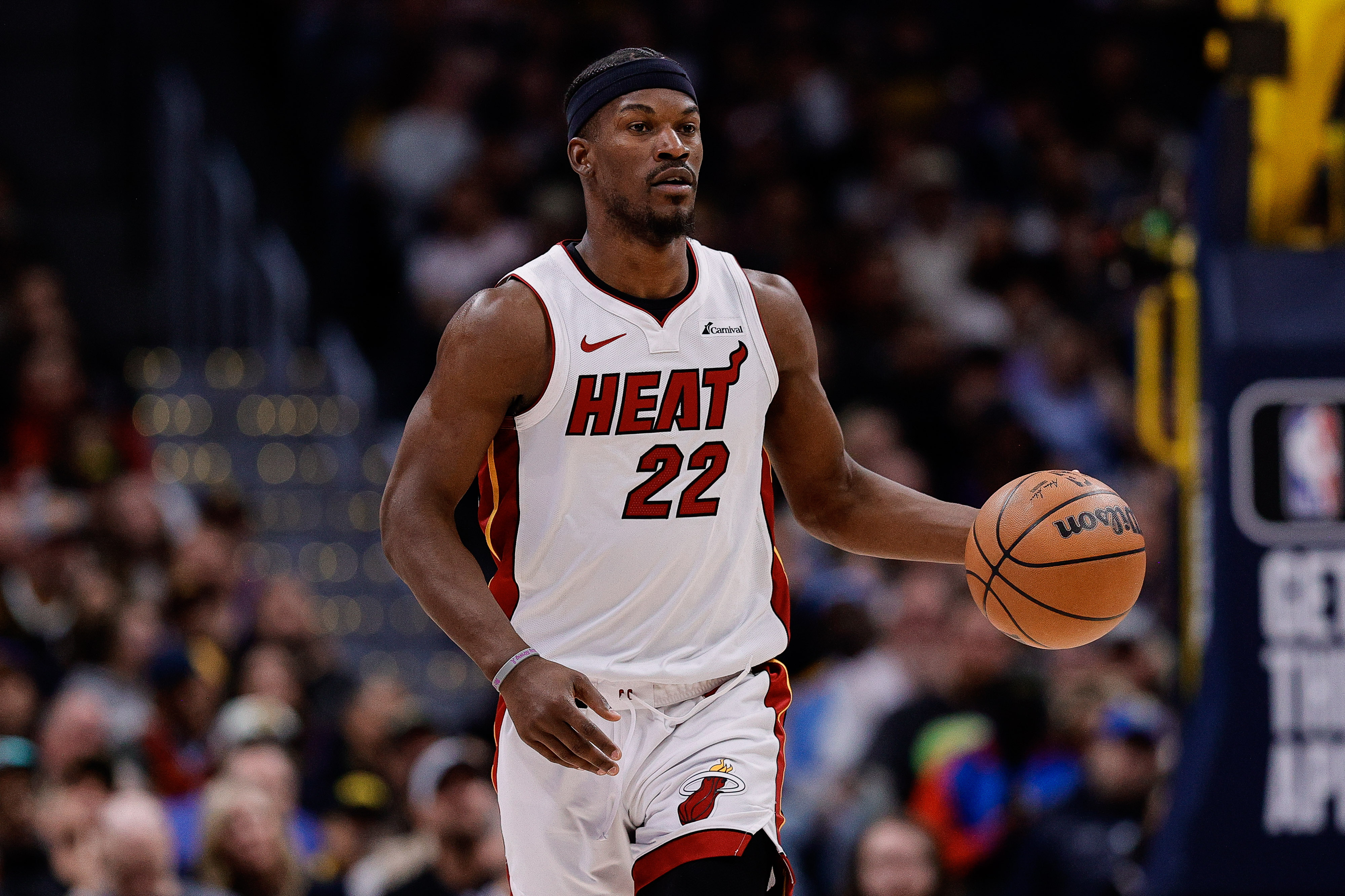 Feb 29, 2024; Denver, Colorado, USA; Miami Heat forward Jimmy Butler (22) dribbles the ball up court in the fourth quarter against the Denver Nuggets at Ball Arena. Mandatory Credit: Isaiah J. Downing-Imagn Images