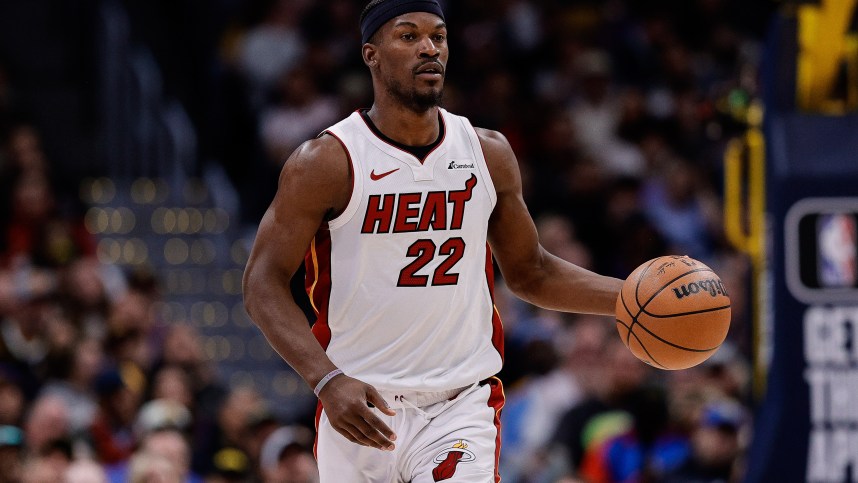 Feb 29, 2024; Denver, Colorado, USA; Miami Heat forward Jimmy Butler (22) dribbles the ball up court in the fourth quarter against the Denver Nuggets at Ball Arena. Mandatory Credit: Isaiah J. Downing-Imagn Images