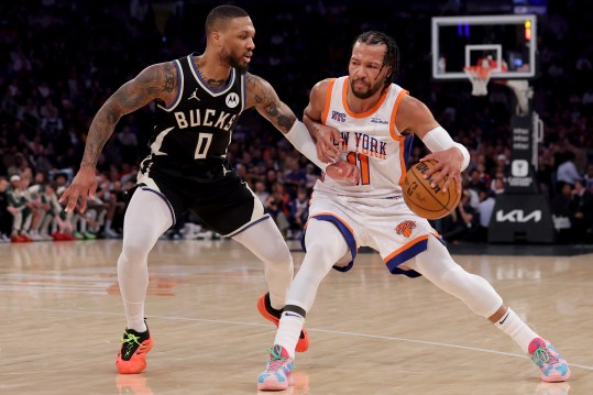 Jan 12, 2025; New York, New York, USA; New York Knicks guard Jalen Brunson (11) controls the ball against Milwaukee Bucks guard Damian Lillard (0) during the first quarter at Madison Square Garden. Mandatory Credit: Brad Penner-Imagn Images