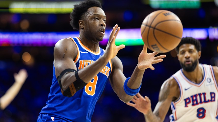 Jan 15, 2025; Philadelphia, Pennsylvania, USA; New York Knicks forward OG Anunoby (8) catches a pass in front of Philadelphia 76ers forward Paul George (8) during the first quarter at Wells Fargo Center. Mandatory Credit: Bill Streicher-Imagn Images