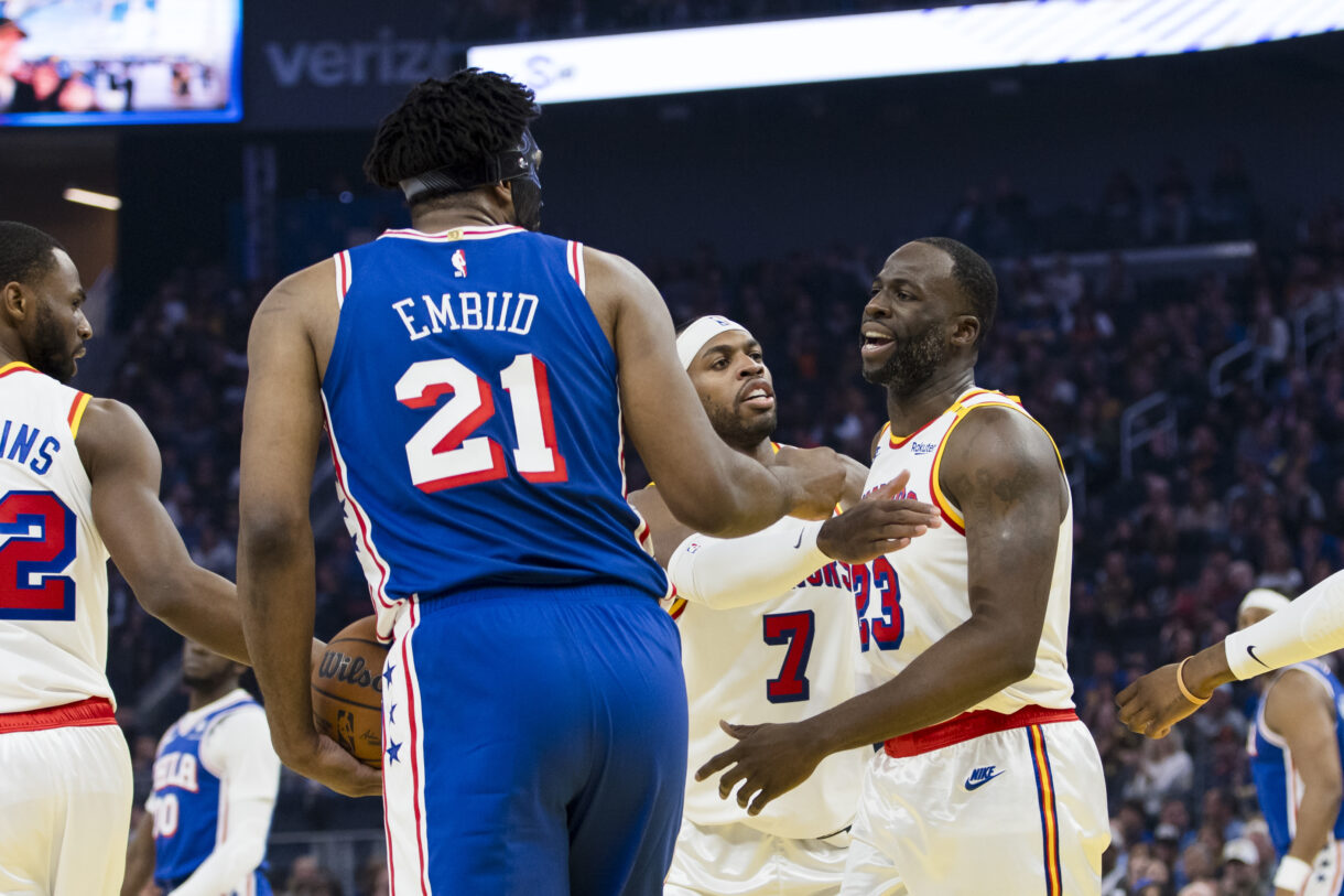 Jan 2, 2025; San Francisco, California, USA; Golden State Warriors forward Draymond Green (23) reacts after being fouled by Philadelphia 76ers center Joel Embiid (21) during the first quarter at Chase Center. Mandatory Credit: John Hefti-Imagn Images