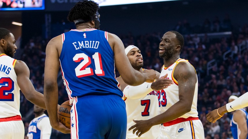 Jan 2, 2025; San Francisco, California, USA; Golden State Warriors forward Draymond Green (23) reacts after being fouled by Philadelphia 76ers center Joel Embiid (21) during the first quarter at Chase Center. Mandatory Credit: John Hefti-Imagn Images