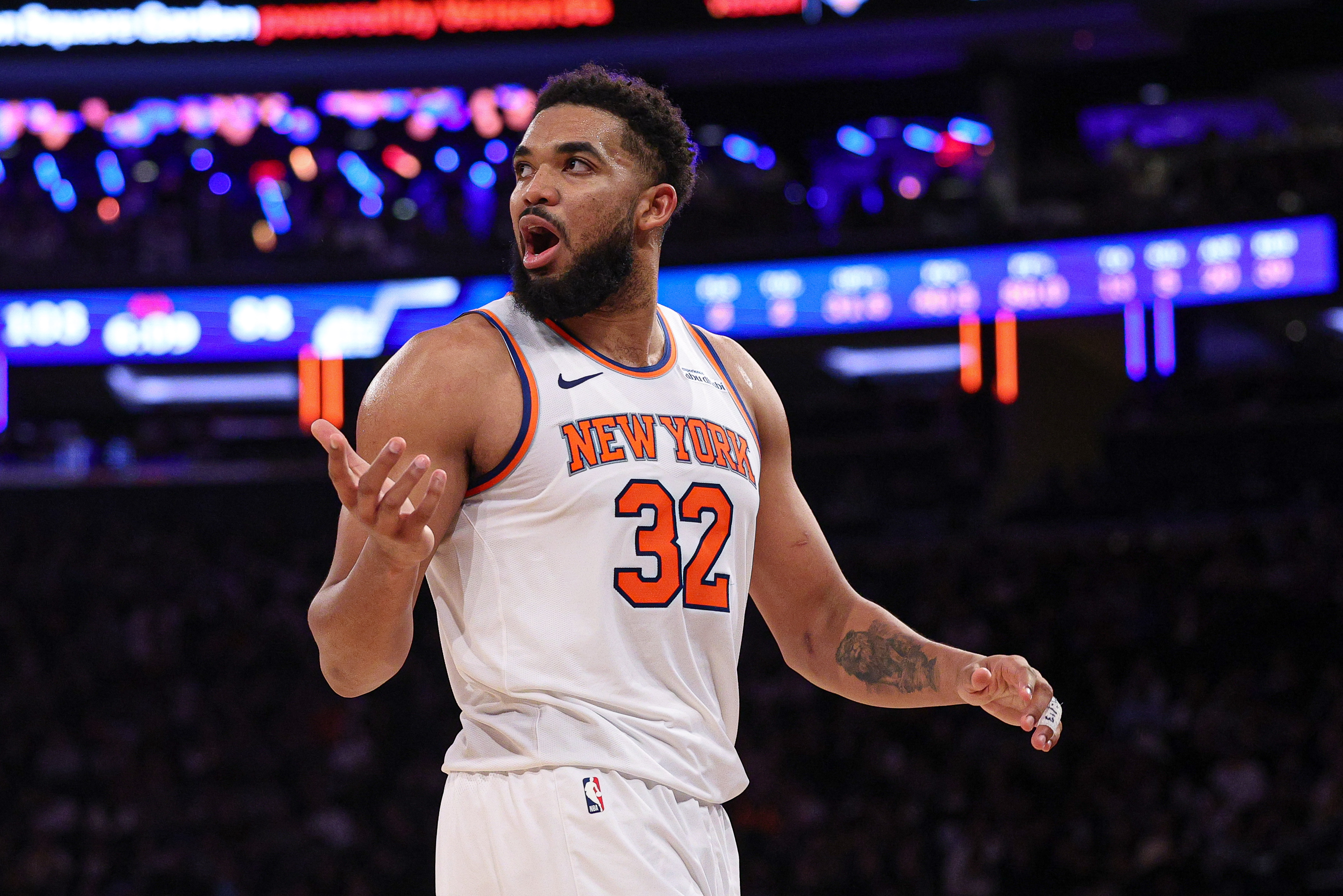 Jan 1, 2025; New York, New York, USA; New York Knicks center Karl-Anthony Towns (32) reacts during the second half against the Utah Jazz at Madison Square Garden. Mandatory Credit: Vincent Carchietta-Imagn Images