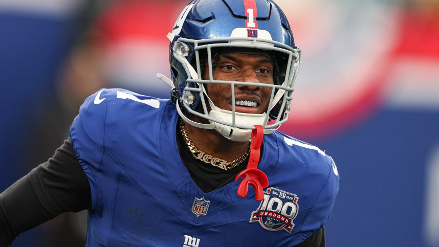 Dec 29, 2024; East Rutherford, New Jersey, USA; New York Giants wide receiver Malik Nabers (1) celebrates after a touchdown reception during the second half against the Indianapolis Colts at MetLife Stadium. Mandatory Credit: Vincent Carchietta-Imagn Images