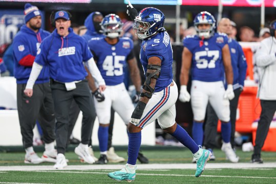 Dec 8, 2024; East Rutherford, New Jersey, USA; New York Giants linebacker Kayvon Thibodeaux (5) celebrates after a sack during the second half against the New Orleans Saints at MetLife Stadium. Mandatory Credit: Vincent Carchietta-Imagn Images