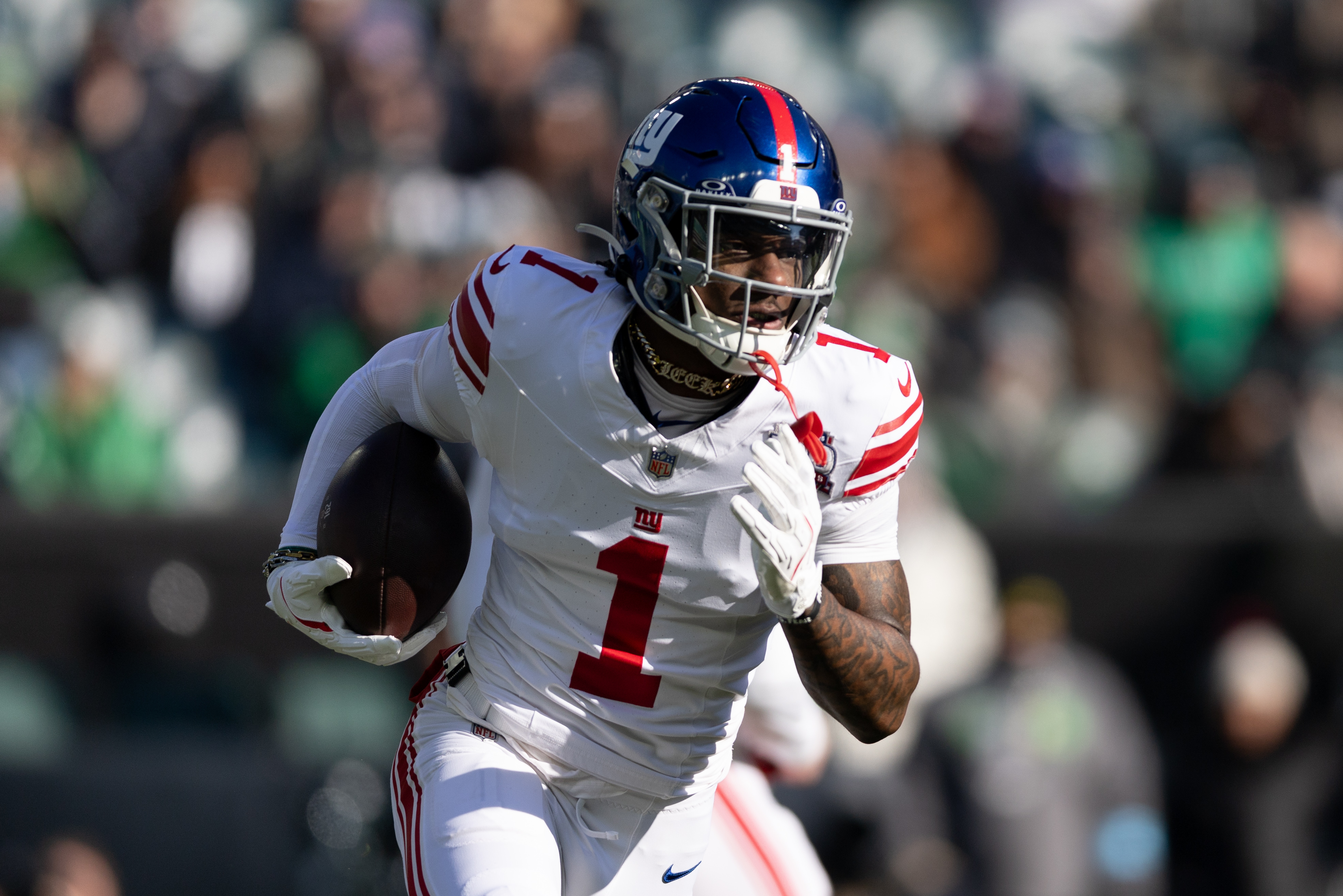 Jan 5, 2025; Philadelphia, Pennsylvania, USA; New York Giants wide receiver Malik Nabers (1) runs with the ball against the Philadelphia Eagles during the first quarter at Lincoln Financial Field. Mandatory Credit: Bill Streicher-Imagn Images