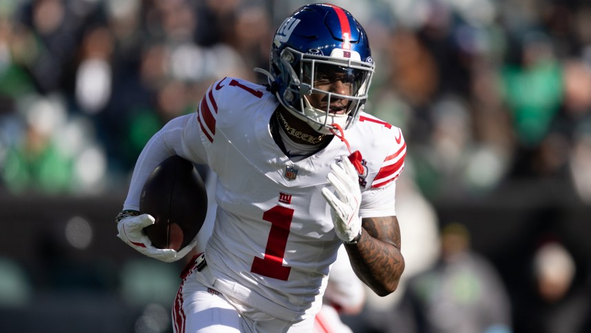 Jan 5, 2025; Philadelphia, Pennsylvania, USA; New York Giants wide receiver Malik Nabers (1) runs with the ball against the Philadelphia Eagles during the first quarter at Lincoln Financial Field. Mandatory Credit: Bill Streicher-Imagn Images