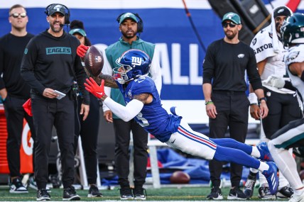 Oct 20, 2024; East Rutherford, New Jersey, USA; New York Giants wide receiver Jalin Hyatt (13) attempts to catch a pass in front of Philadelphia Eagles safety Tristin McCollum (36) during the second half at MetLife Stadium. Mandatory Credit: Vincent Carchietta-Imagn Images