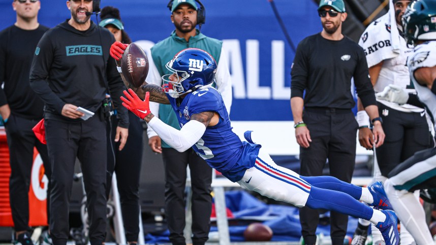 Oct 20, 2024; East Rutherford, New Jersey, USA; New York Giants wide receiver Jalin Hyatt (13) attempts to catch a pass in front of Philadelphia Eagles safety Tristin McCollum (36) during the second half at MetLife Stadium. Mandatory Credit: Vincent Carchietta-Imagn Images