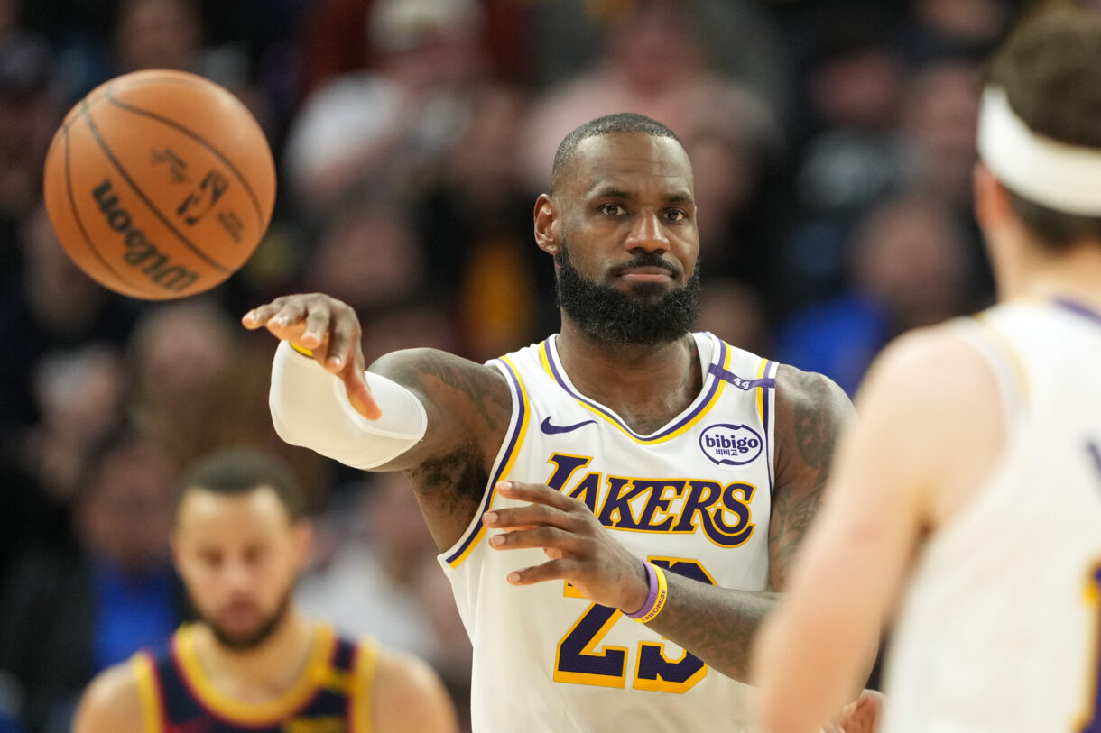 Jan 25, 2025; San Francisco, California, USA; Los Angeles Lakers forward LeBron James (23) passes against the Golden State Warriors during the fourth quarter at Chase Center. Mandatory Credit: Darren Yamashita-Imagn Images